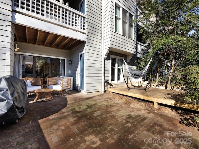 view of patio featuring a grill