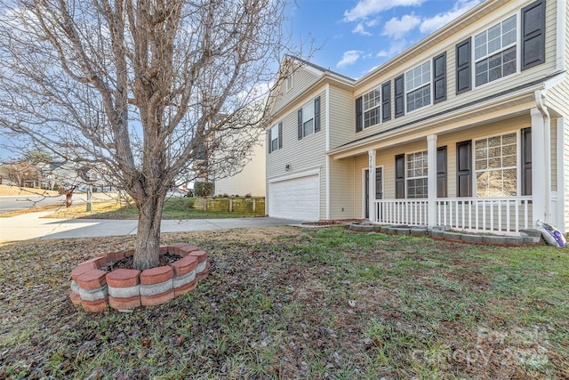 view of property exterior with a porch and a garage