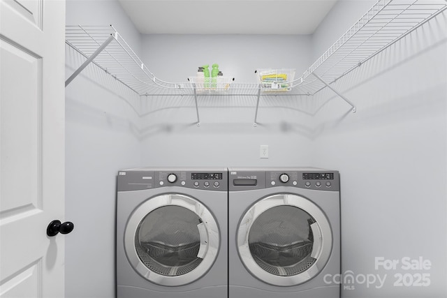 laundry area with washing machine and dryer