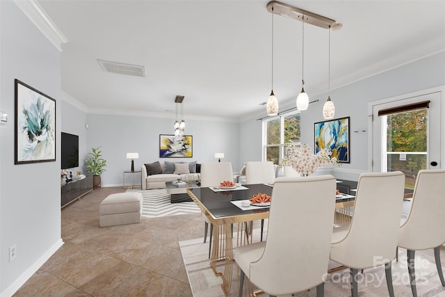 dining room featuring crown molding and a wealth of natural light