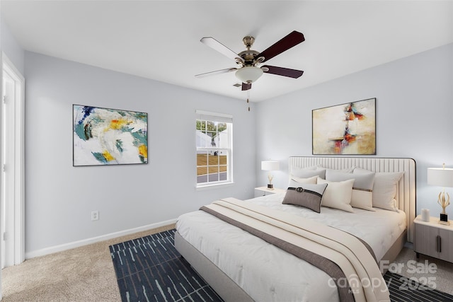 carpeted bedroom featuring ceiling fan