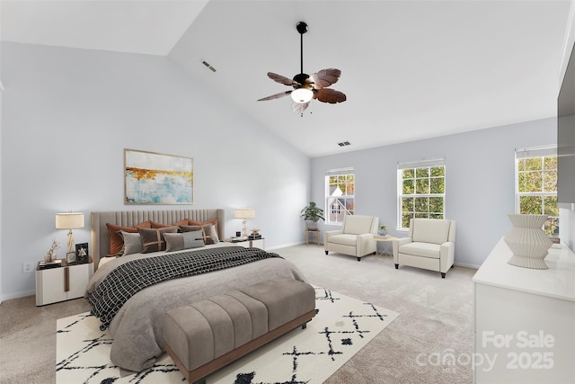 bedroom featuring ceiling fan, high vaulted ceiling, and light carpet