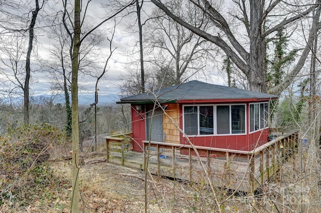 view of front of home featuring a deck with mountain view