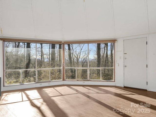 unfurnished sunroom featuring a wealth of natural light