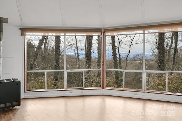 unfurnished sunroom with plenty of natural light