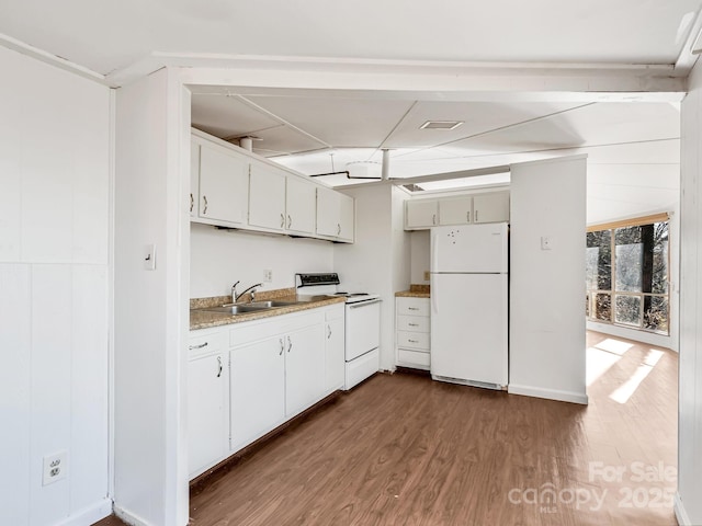 kitchen with white cabinetry, sink, dark wood-type flooring, and white appliances