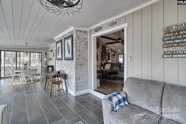 interior space featuring ornamental molding, plenty of natural light, wooden ceiling, and ceiling fan