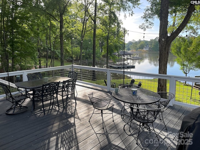 wooden deck featuring a water view