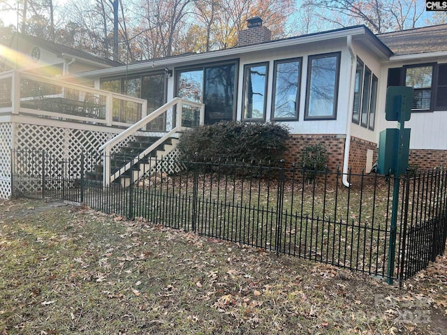 view of side of property with a sunroom