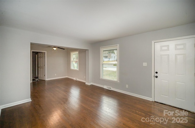 interior space featuring ceiling fan and dark hardwood / wood-style floors