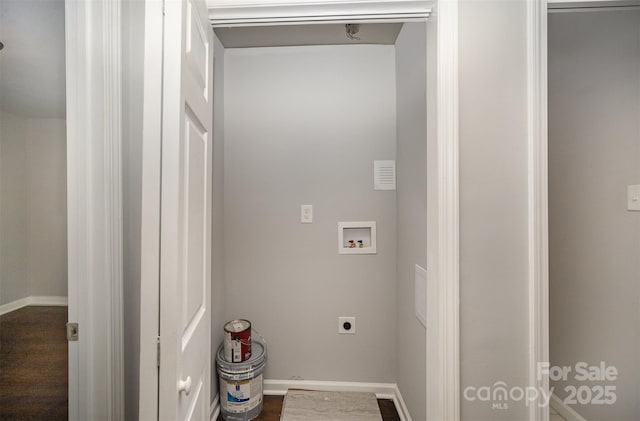 washroom featuring dark wood-type flooring, washer hookup, and hookup for an electric dryer