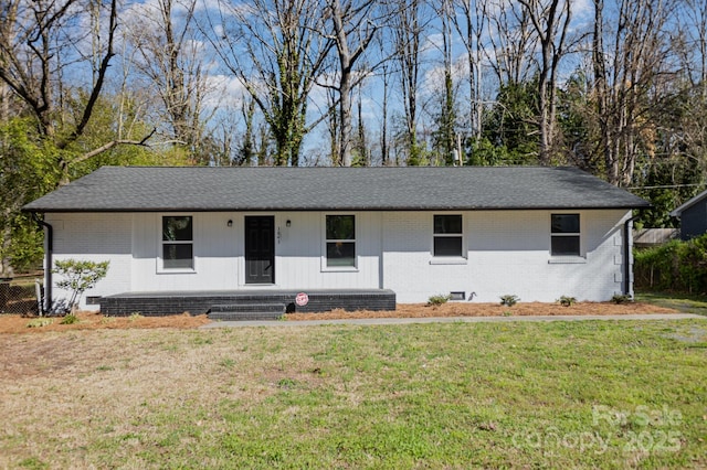 3843 Foxford Pl, Charlotte, NC 28215 - ranch-style house with brick siding, a front yard, and a shingled roof