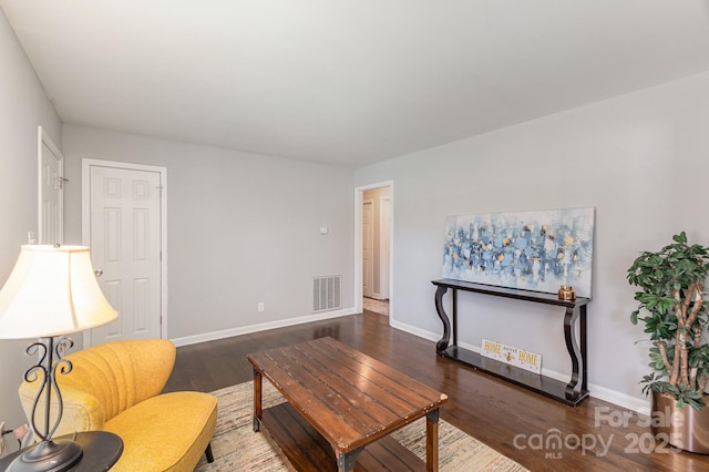3843 Foxford Pl, Charlotte, NC 28215 - living room with visible vents, baseboards, and wood finished floors