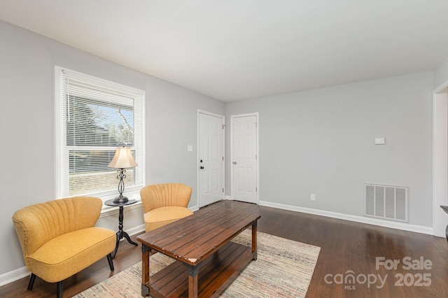 3843 Foxford Pl, Charlotte, NC 28215 - sitting room with visible vents, baseboards, and dark wood-style flooring
