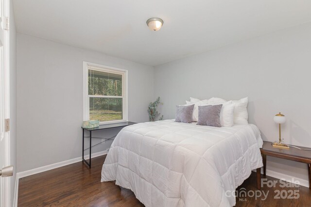 3843 Foxford Pl, Charlotte, NC 28215 - bedroom featuring baseboards and wood finished floors