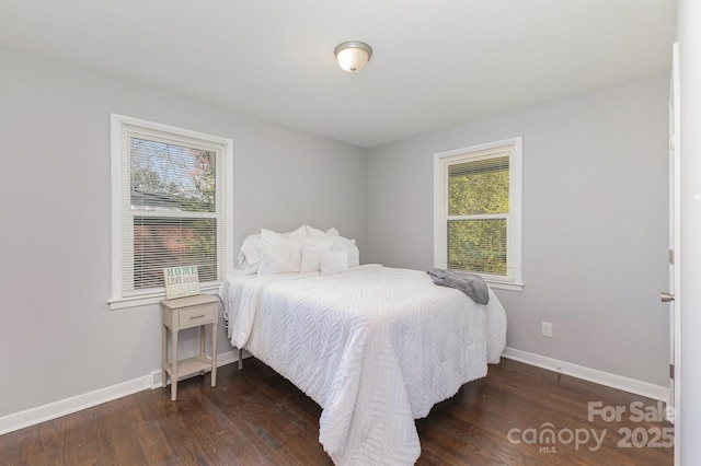 3843 Foxford Pl, Charlotte, NC 28215 - bedroom with baseboards and wood finished floors