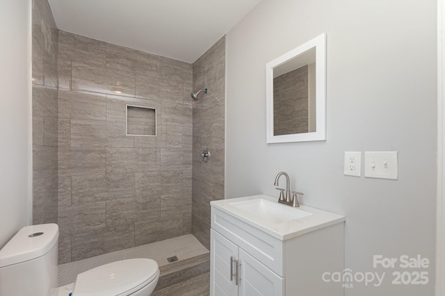 3843 Foxford Pl, Charlotte, NC 28215 - full bathroom featuring vanity, toilet, and a tile shower