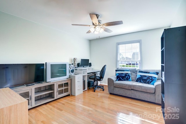 office space with ceiling fan and light hardwood / wood-style flooring