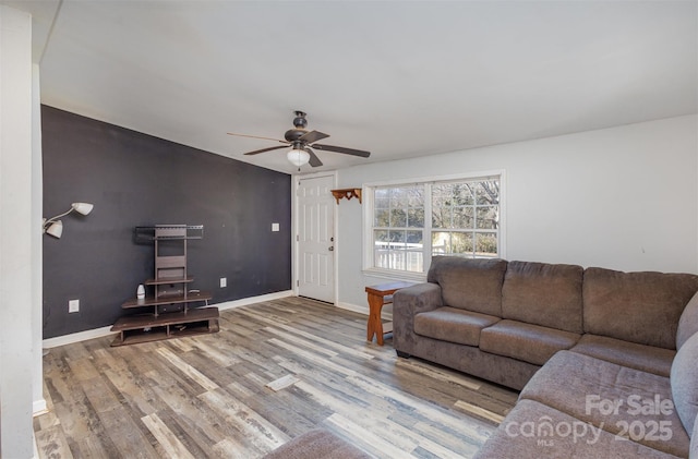 living room with hardwood / wood-style floors and ceiling fan