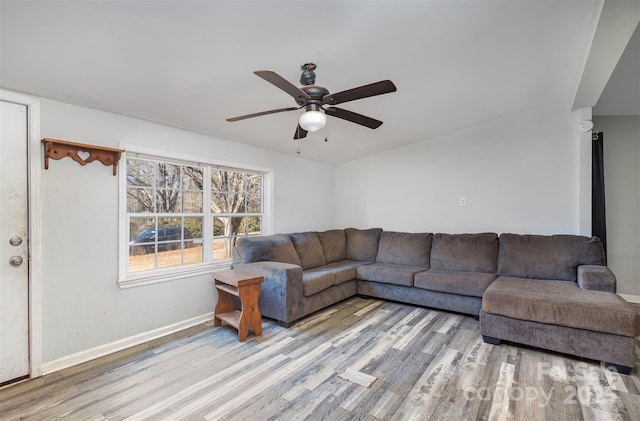 living room with hardwood / wood-style flooring and ceiling fan