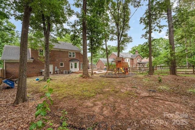 view of yard with a playground and fence