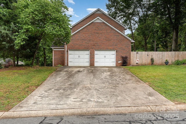 garage with concrete driveway
