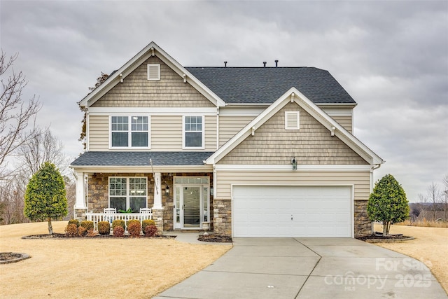 craftsman-style home with a garage and covered porch