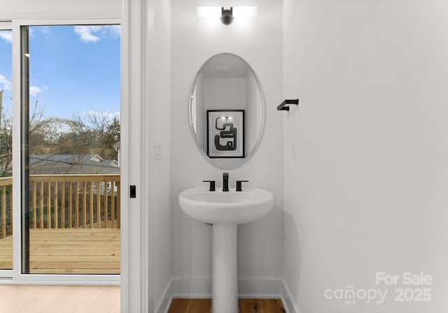 bathroom featuring sink and wood-type flooring