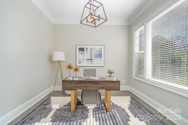 office featuring an inviting chandelier, crown molding, baseboards, and wood finished floors