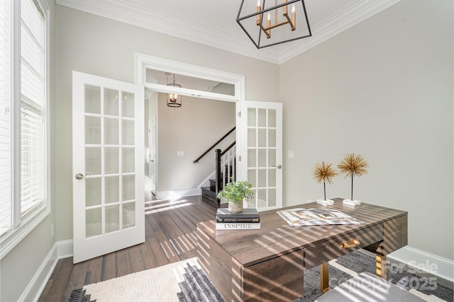 office space featuring an inviting chandelier, ornamental molding, wood finished floors, and french doors