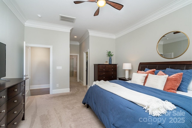 bedroom with carpet floors, baseboards, visible vents, and ornamental molding