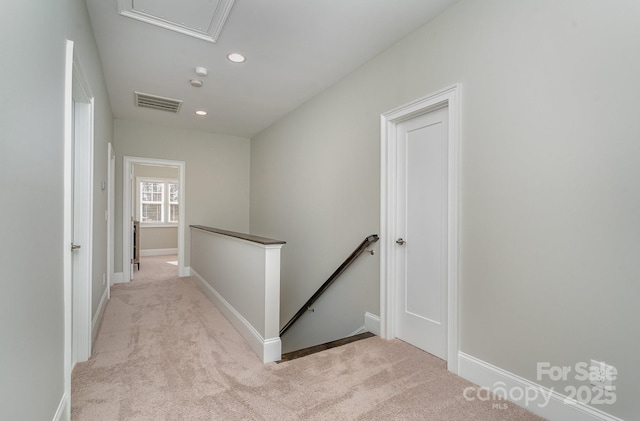 hall with carpet, recessed lighting, visible vents, an upstairs landing, and baseboards