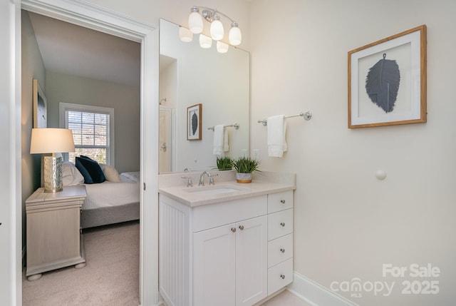 ensuite bathroom featuring ensuite bath and vanity