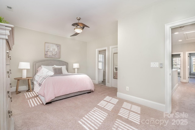 carpeted bedroom featuring a ceiling fan, multiple windows, visible vents, and baseboards