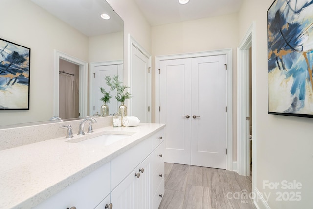 bathroom with vanity and recessed lighting