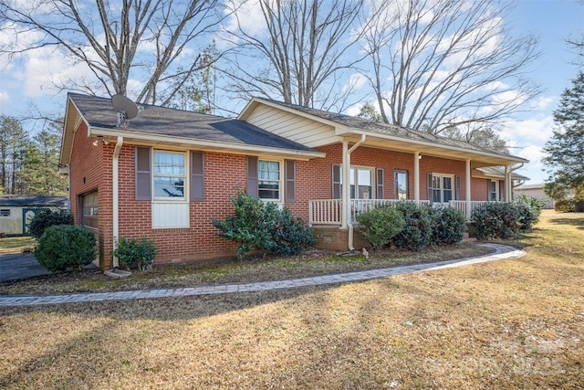 view of front facade with a garage, a porch, and a front lawn