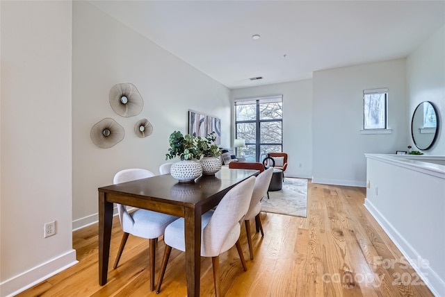 dining space featuring light hardwood / wood-style flooring