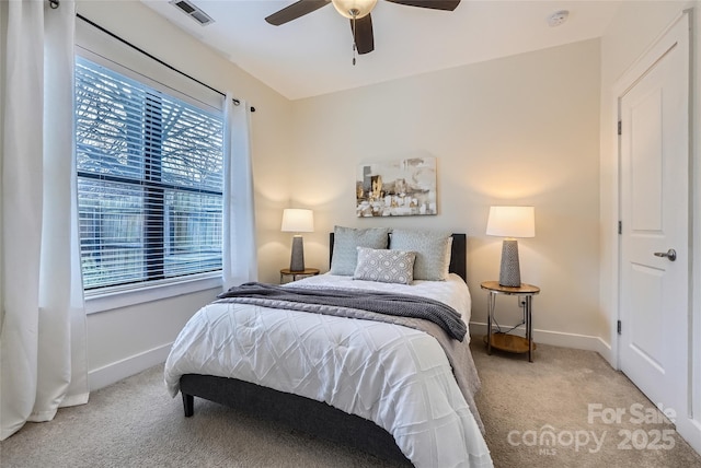 bedroom featuring light colored carpet and ceiling fan