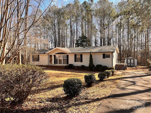 view of front of house featuring a shed