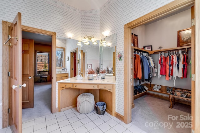 bathroom with tile patterned floors and vanity