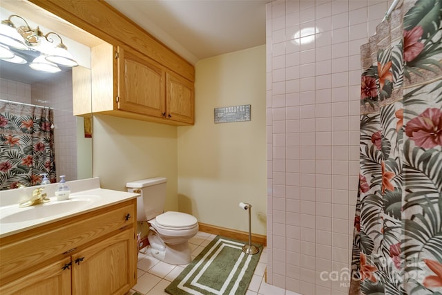 bathroom featuring vanity, toilet, tile patterned floors, and walk in shower