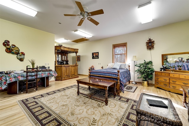 bedroom featuring ceiling fan and hardwood / wood-style floors