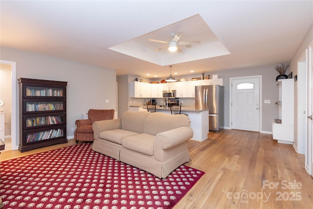 210 State St, Asheville, NC 28806 - living room with a raised ceiling, ceiling fan, and light hardwood / wood-style floors