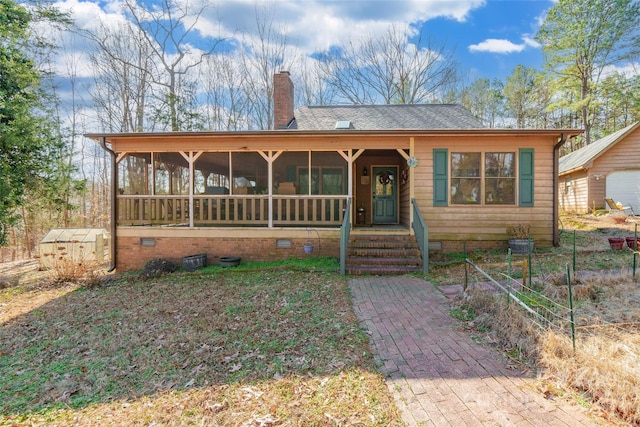 view of front facade featuring a sunroom