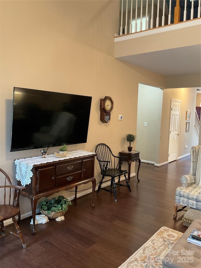 living room with dark hardwood / wood-style flooring