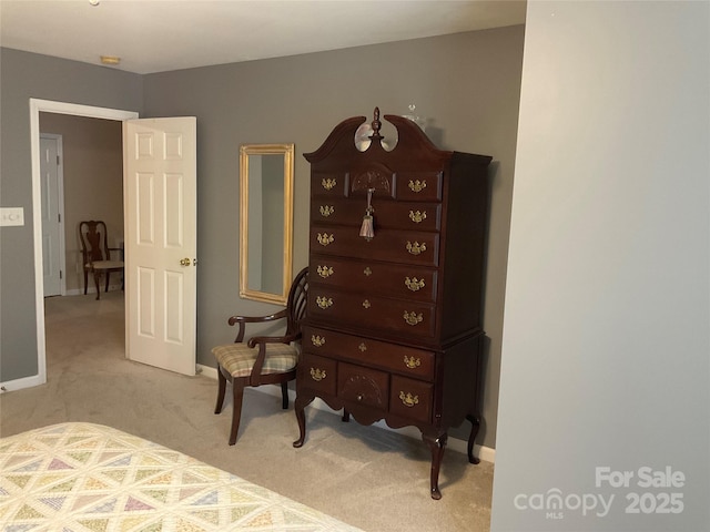 bedroom featuring light carpet