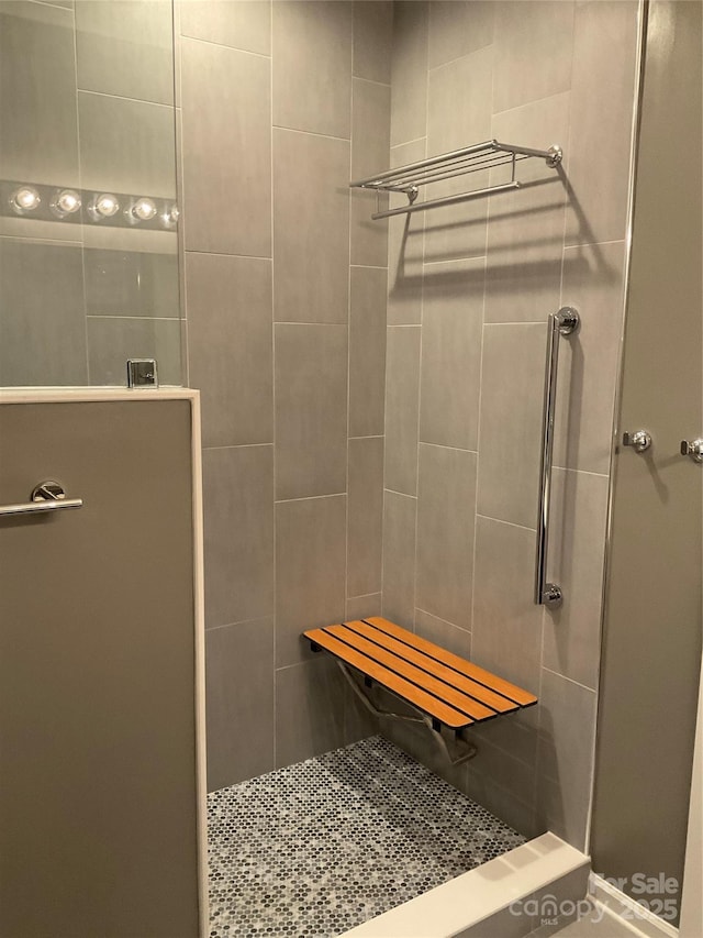 bathroom with a tile shower