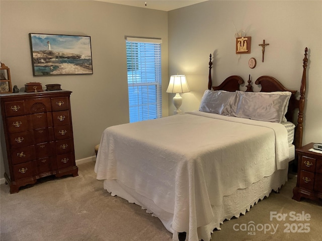 bedroom featuring light colored carpet