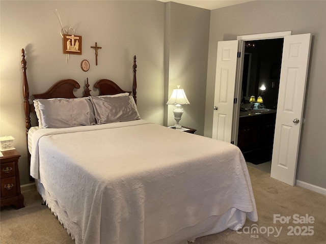 bedroom featuring light carpet