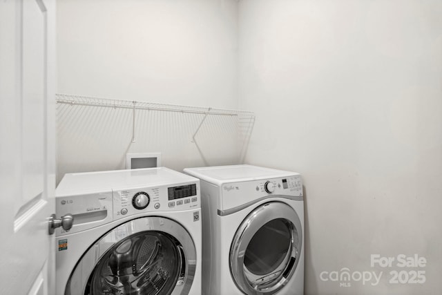 washroom with washer and clothes dryer